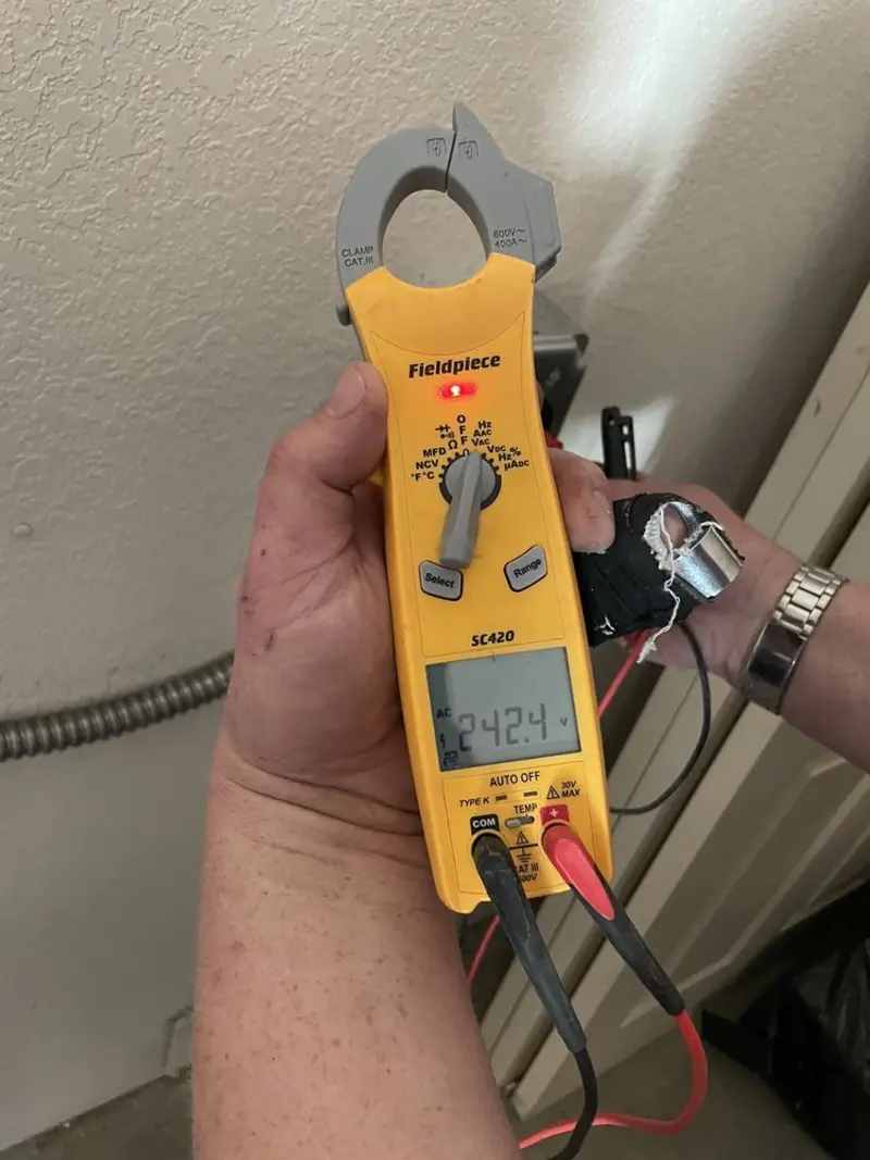 Voltage testing with clamp meter during Outlet Installation in Augusta